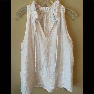 White sleeveless v neck blouse